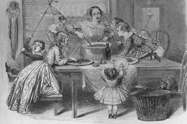 A Victorian illustration of a mother and children making Christmas pudding.