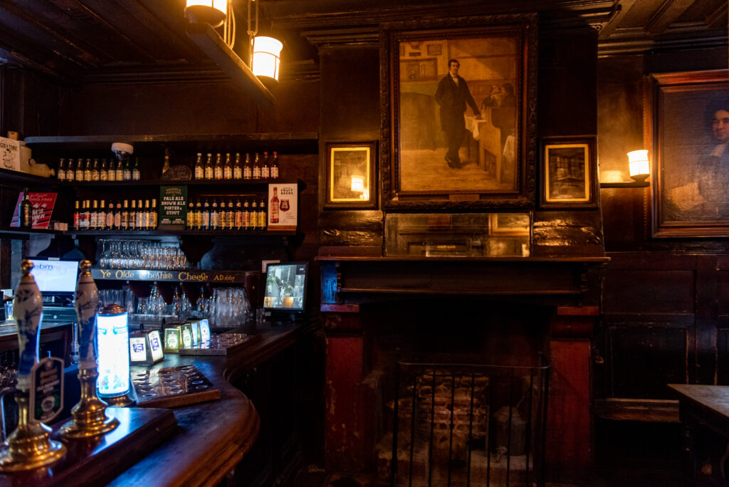Interior of Ye Olde Cheshire Cheese, showing the bar and fireplace that evoke its seventeenth-century setting. (Image credit: Ye Olde Cheshire Cheese)
